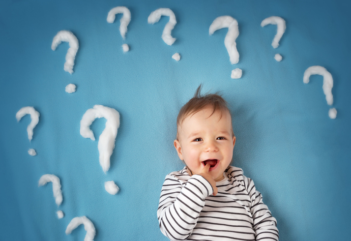 funny little boy with lots of question marks
